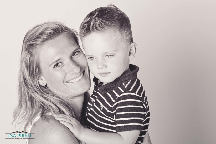 Mother and son in sweet embrace in black and white nursery shoot picture